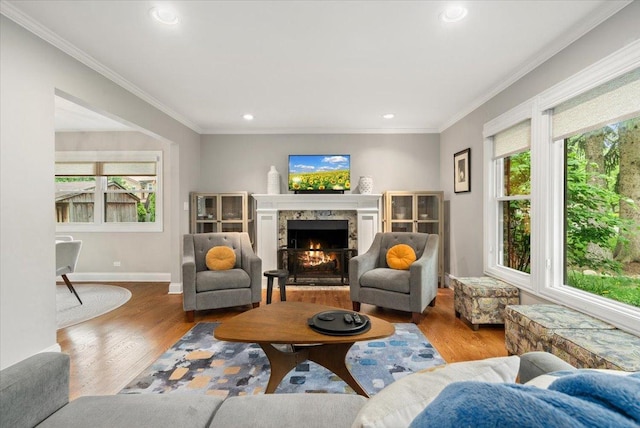 1738 E Jonquil Ter, Arlington Heights, IL 60004 - living area featuring plenty of natural light, wood finished floors, a premium fireplace, crown molding, and recessed lighting