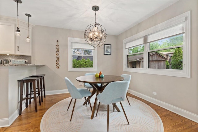 1738 E Jonquil Ter, Arlington Heights, IL 60004 - dining space with light wood-style floors and a chandelier