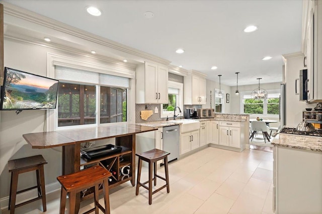1738 E Jonquil Ter, Arlington Heights, IL 60004 - kitchen featuring stainless steel appliances, a peninsula, recessed lighting, backsplash, and light stone counters