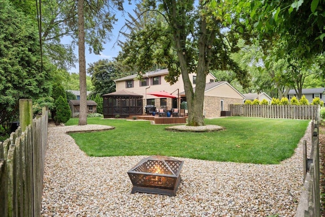 1738 E Jonquil Ter, Arlington Heights, IL 60004 - fenced backyard featuring a fire pit, a patio area, and a deck
