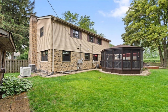 1738 E Jonquil Ter, Arlington Heights, IL 60004 - rear view of house with a chimney, a sunroom, and brick siding
