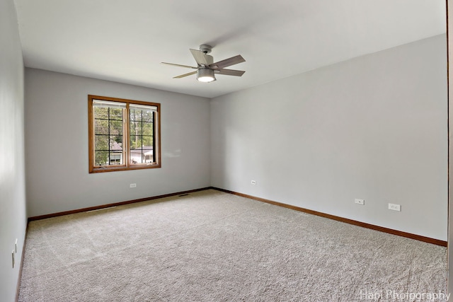 1506 Wilson Ct, Zion, IL 60099 - carpeted empty room with a ceiling fan and baseboards