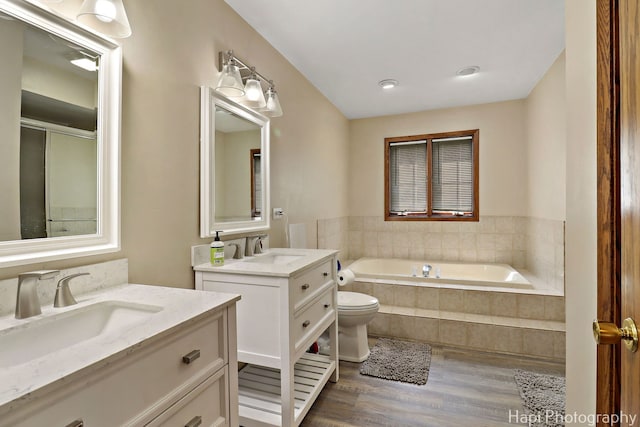 1506 Wilson Ct, Zion, IL 60099 - full bath featuring wood finished floors, a garden tub, and two vanities