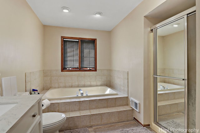 1506 Wilson Ct, Zion, IL 60099 - bathroom with a garden tub, wood finished floors, vanity, and a shower stall