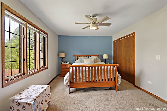 1506 Wilson Ct, Zion, IL 60099 - carpeted bedroom with multiple windows, a closet, and a ceiling fan
