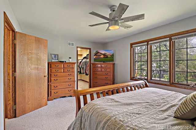 1506 Wilson Ct, Zion, IL 60099 - carpeted bedroom featuring a walk in closet, a closet, and ceiling fan