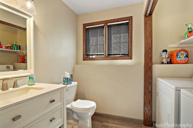1506 Wilson Ct, Zion, IL 60099 - bathroom featuring independent washer and dryer, wood finished floors, and vanity