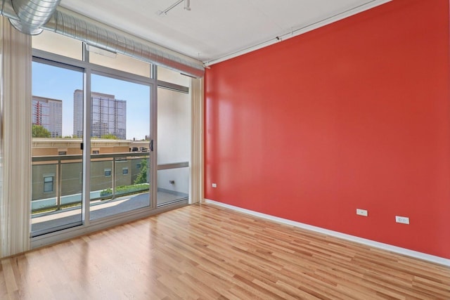 1819 S Michigan Ave Unit 406, Chicago, IL 60616 - unfurnished room featuring wood finished floors and a view of city