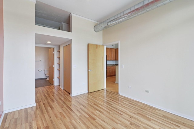 1819 S Michigan Ave Unit 406, Chicago, IL 60616 - empty room with a towering ceiling and light wood-style floors