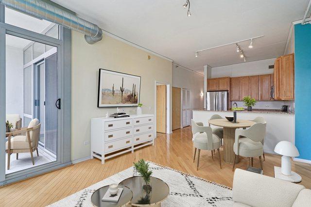 1819 S Michigan Ave Unit 406, Chicago, IL 60616 - living area with rail lighting and light wood-style flooring