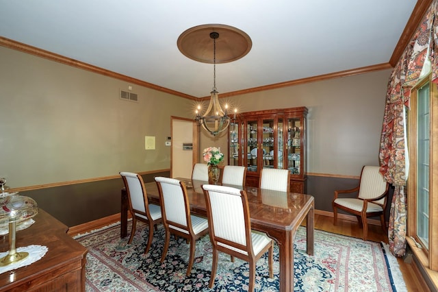 1315 Keim Trl, Saint Charles, IL 60174 - dining space with a chandelier, wood finished floors, and crown molding