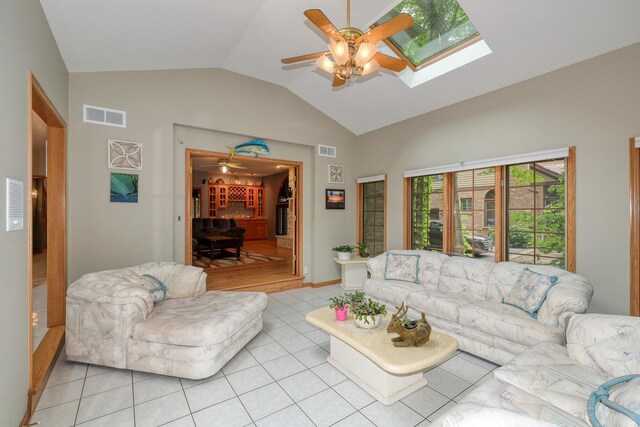 1315 Keim Trl, Saint Charles, IL 60174 - living area with a ceiling fan, lofted ceiling, a skylight, and light tile patterned floors