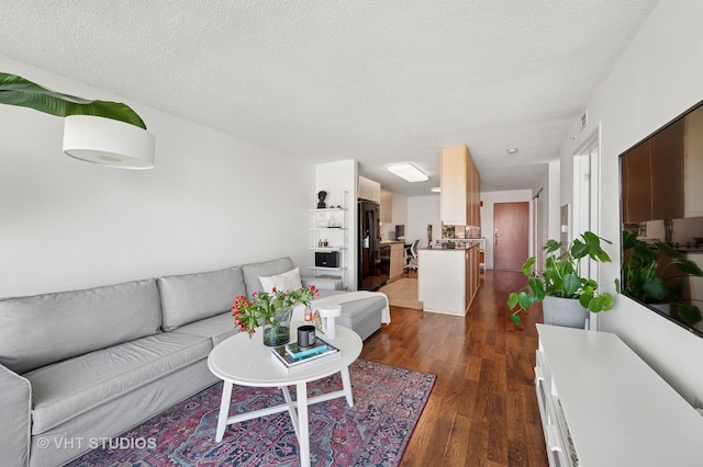 800 Elgin Rd Unit 1316, Evanston, IL 60201 - living area with dark wood-style floors and a textured ceiling
