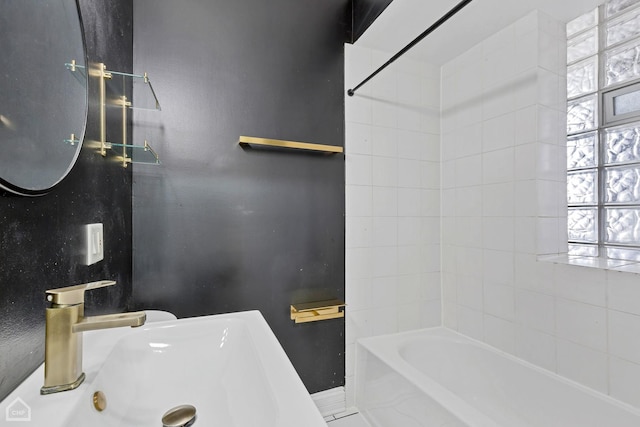 3608 W Dickens Ave Unit 2F, Chicago, IL 60647 - bathroom featuring a tub to relax in and a sink