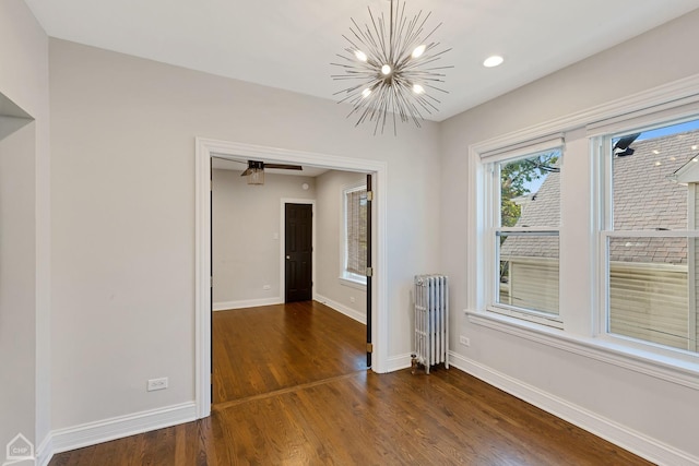 3608 W Dickens Ave Unit 2F, Chicago, IL 60647 - spare room with radiator heating unit, dark wood-type flooring, a chandelier, and recessed lighting