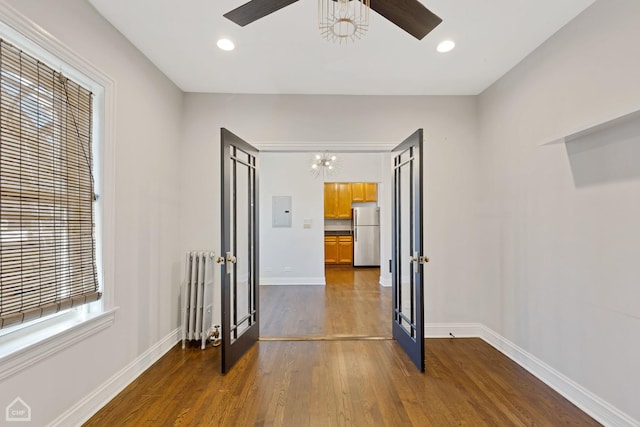 3608 W Dickens Ave Unit 2F, Chicago, IL 60647 - unfurnished room with french doors, electric panel, radiator, a ceiling fan, and dark wood-type flooring