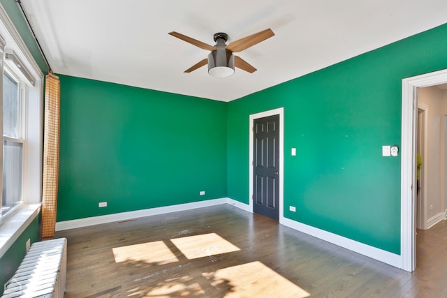 3608 W Dickens Ave Unit 2F, Chicago, IL 60647 - spare room with ceiling fan, radiator, and wood finished floors