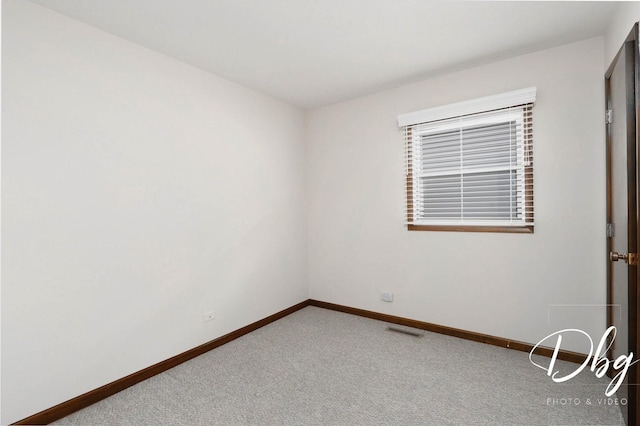 1323 Beverly Dr, Round Lake Beach, IL 60073 - carpeted spare room featuring baseboards