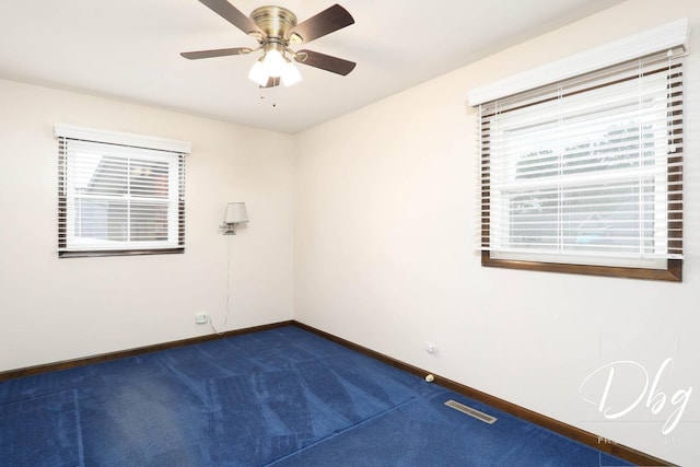 1323 Beverly Dr, Round Lake Beach, IL 60073 - unfurnished room featuring dark colored carpet and a ceiling fan