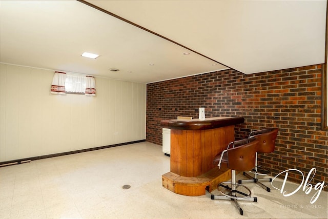 1323 Beverly Dr, Round Lake Beach, IL 60073 - indoor dry bar with light floors and brick wall