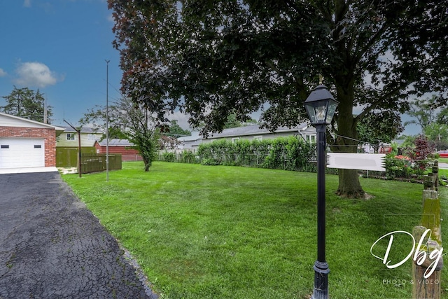 1323 Beverly Dr, Round Lake Beach, IL 60073 - view of yard featuring a garage