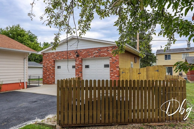 1323 Beverly Dr, Round Lake Beach, IL 60073 - view of front of property with brick siding and a detached garage
