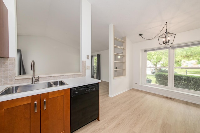 2060 Navarone Dr, Naperville, IL 60565 - kitchen featuring black dishwasher, brown cabinets, a chandelier, lofted ceiling, and light wood finished floors