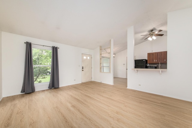 2060 Navarone Dr, Naperville, IL 60565 - unfurnished living room featuring light wood-style floors, a ceiling fan, and vaulted ceiling