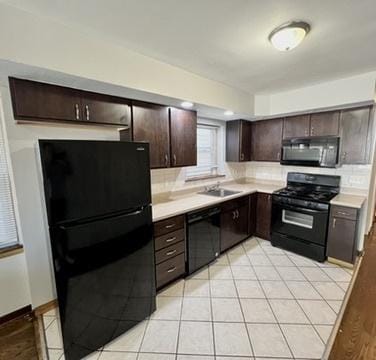 1340 Wesley Ave, Berwyn, IL 60402 - kitchen with black appliances, dark brown cabinets, light countertops, tasteful backsplash, and light tile patterned floors