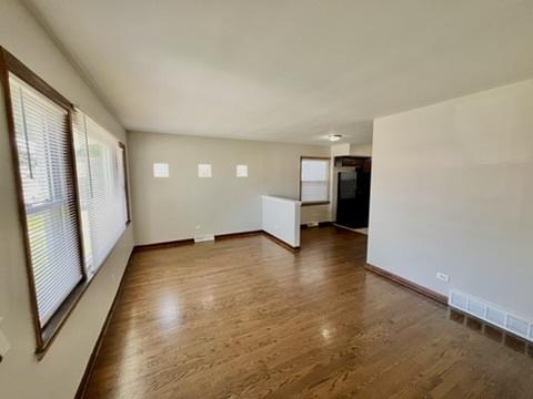 1340 Wesley Ave, Berwyn, IL 60402 - spare room featuring plenty of natural light and wood finished floors