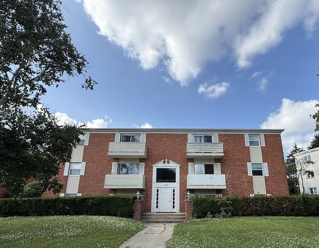 1002 E Harding Dr Unit 303, Urbana, IL 61801 - view of front of house with brick siding and a front yard