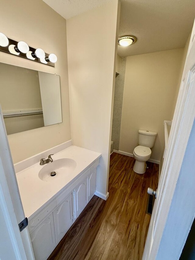 1002 E Harding Dr Unit 303, Urbana, IL 61801 - bathroom with wood finished floors and vanity