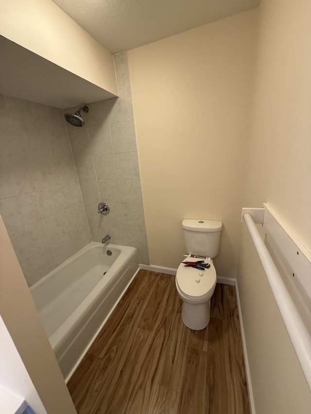 1002 E Harding Dr Unit 303, Urbana, IL 61801 - full bathroom featuring wood finished floors and shower / bath combination
