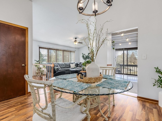 2326 Olde Mill Rd, Plainfield, IL 60586 - dining room with a chandelier, wood finished floors, and a ceiling fan