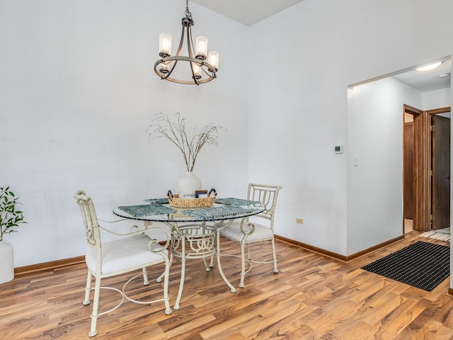 2326 Olde Mill Rd, Plainfield, IL 60586 - dining area featuring a chandelier and light wood-style flooring
