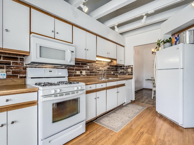 2326 Olde Mill Rd, Plainfield, IL 60586 - kitchen featuring white appliances, decorative backsplash, white cabinetry, beam ceiling, and light wood-style floors