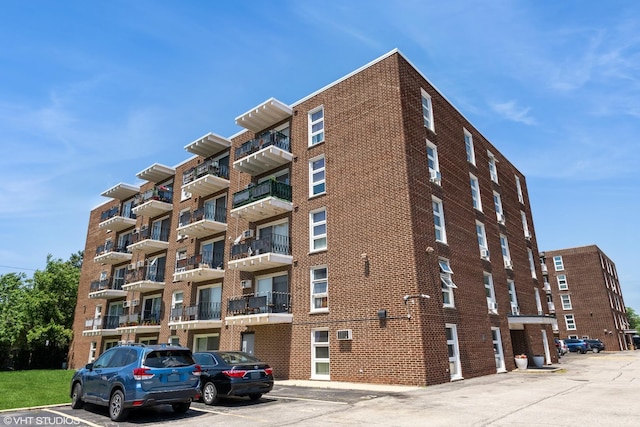 7227 W Higgins Ave Unit 404, Chicago, IL 60656 - view of apartment building / complex with uncovered parking