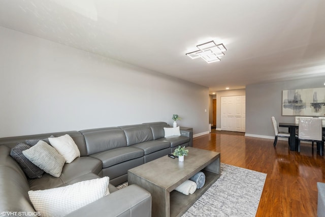 7227 W Higgins Ave Unit 404, Chicago, IL 60656 - living area with dark wood-style floors and baseboards