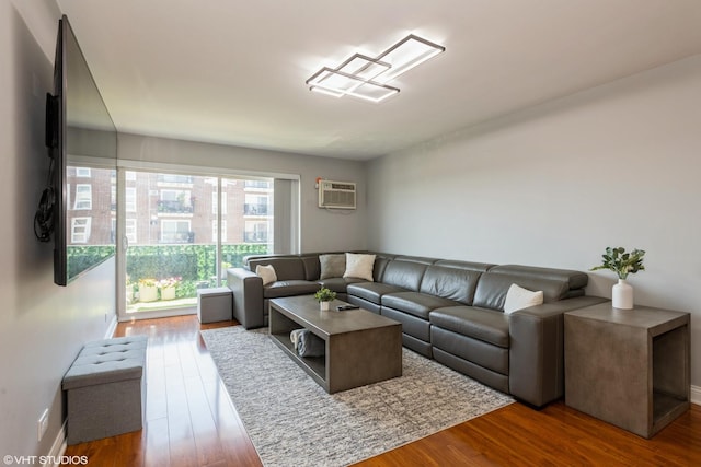 7227 W Higgins Ave Unit 404, Chicago, IL 60656 - living room featuring a wall mounted AC and wood finished floors