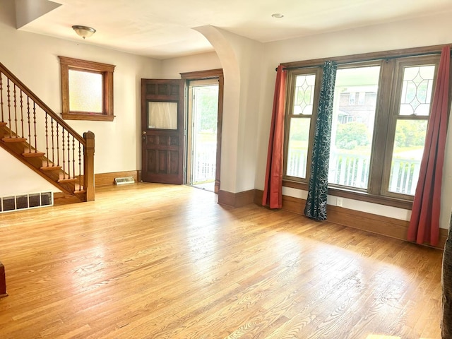 316 N Worth Ave, Elgin, IL 60123 - foyer entrance featuring wood finished floors, stairway, and arched walkways