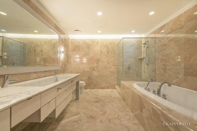 401 N Wabash Ave Unit 39G, Chicago, IL 60611 - full bath with vanity, a bath, a tile shower, tile walls, and recessed lighting