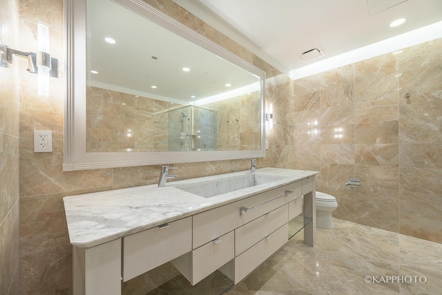 401 N Wabash Ave Unit 39G, Chicago, IL 60611 - full bath featuring tile walls, vanity, a shower with shower door, marble tiled floors, and recessed lighting