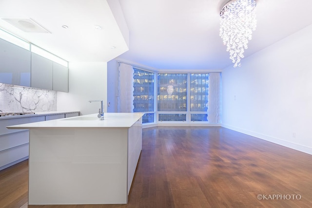401 N Wabash Ave Unit 39G, Chicago, IL 60611 - kitchen featuring tasteful backsplash, light countertops, modern cabinets, a chandelier, and stainless steel gas cooktop