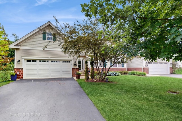 301 W Eagle Ct, Waukegan, IL 60087 - obstructed view of property featuring driveway, brick siding, and a front yard