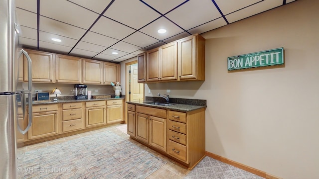 301 W Eagle Ct, Waukegan, IL 60087 - kitchen with freestanding refrigerator, light tile patterned floors, light brown cabinetry, a paneled ceiling, and recessed lighting