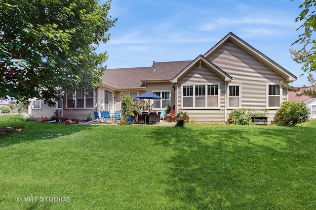 301 W Eagle Ct, Waukegan, IL 60087 - back of house with a lawn and a patio