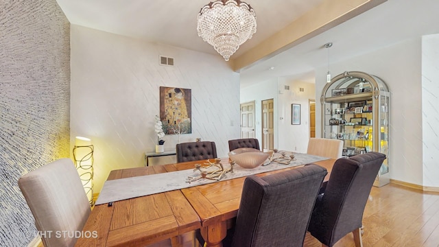 301 W Eagle Ct, Waukegan, IL 60087 - dining space with a chandelier and wood finished floors
