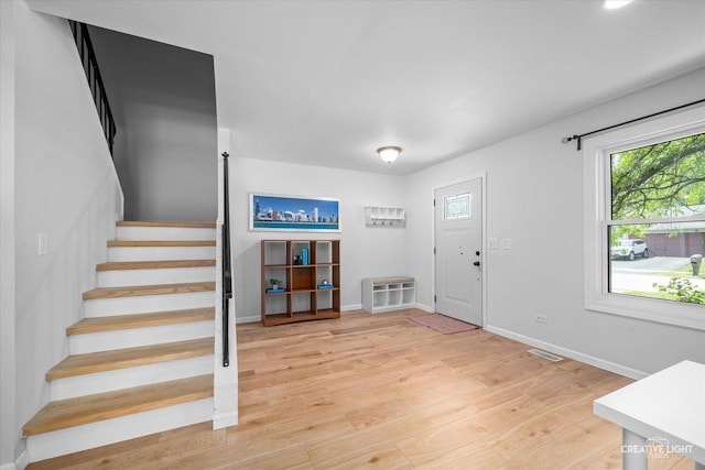 2945 Worcester Ln, Aurora, IL 60504 - entrance foyer with stairway, light wood-style flooring, and healthy amount of natural light