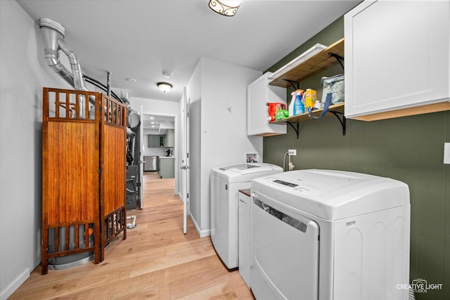 2945 Worcester Ln, Aurora, IL 60504 - washroom with cabinet space, separate washer and dryer, and light wood-style flooring