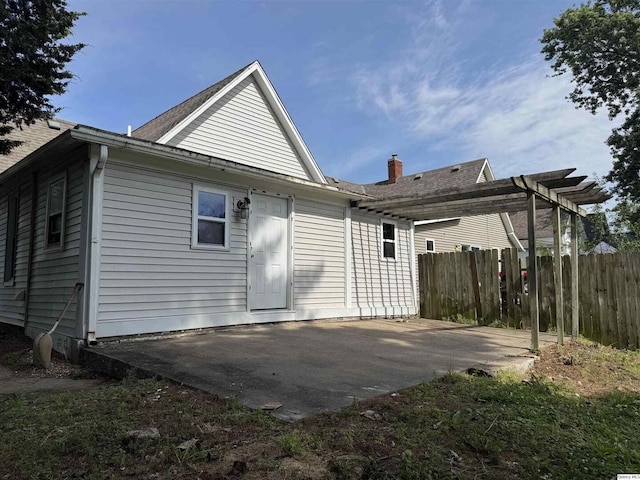 1422 N 3rd, Quincy, IL 62301 - rear view of property with a patio area, a pergola, and roof with shingles